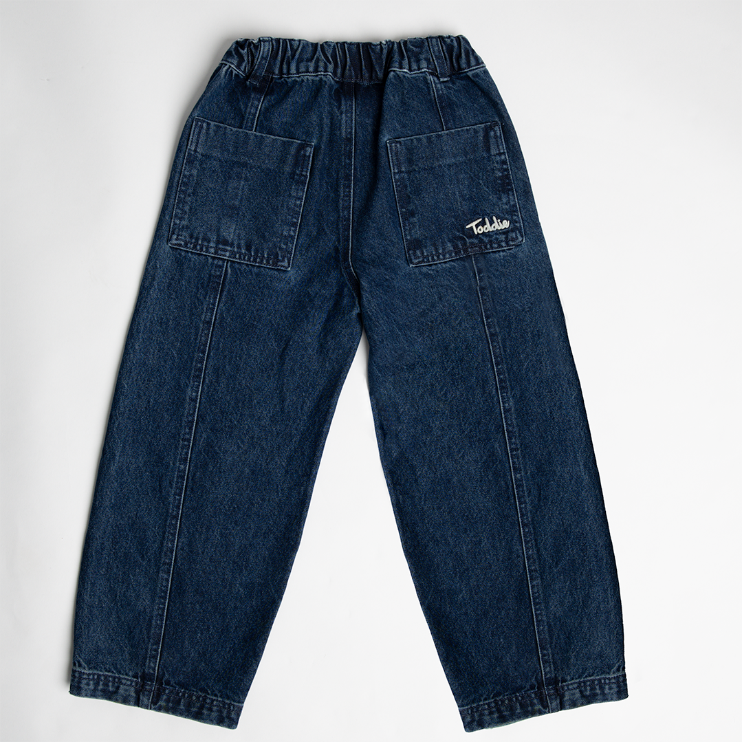 Balloon styled - Denim Jeans in dark blue with elastic waistband and Toddie logo on back pocket, unisex balloon fit design.