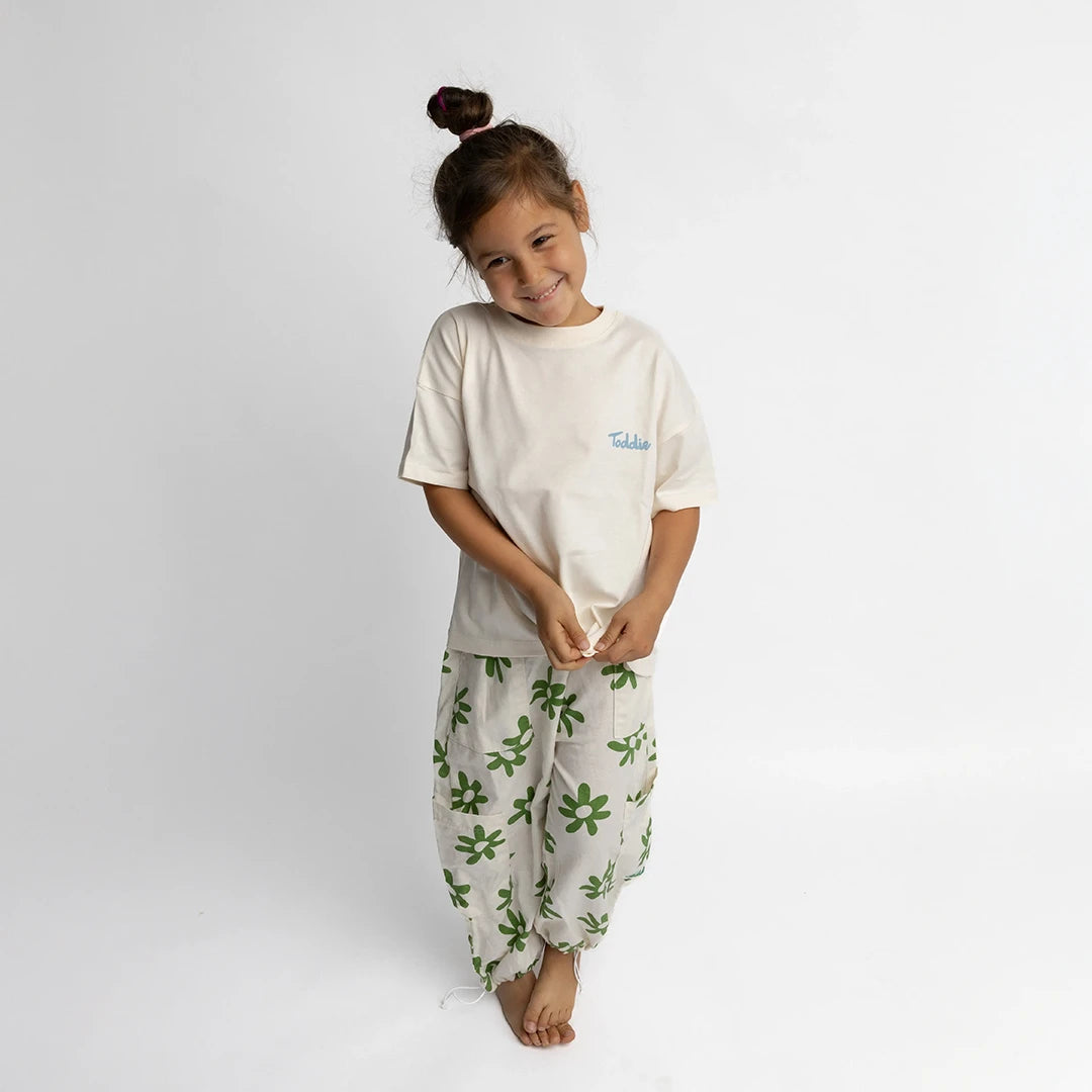 Cute kid rocking the Sweet Harvest - Oversized Tee Cream with a comfy fit by Toddie.
