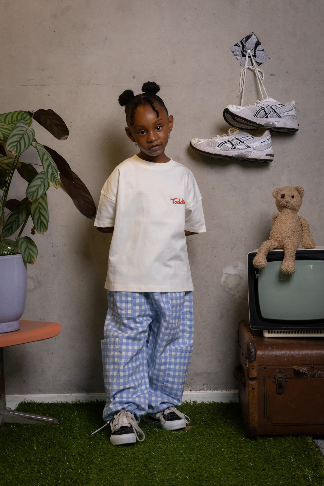 FIT #6 outfit on a confident kid who's keeping it real and creative, only from Toddie.