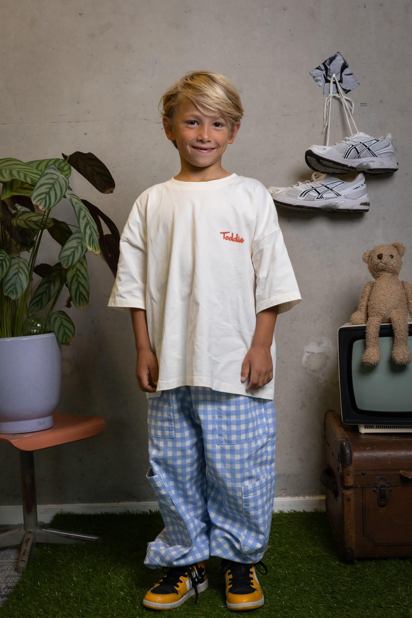 FIT #6 casual cool kid rocking oversized tee and checkered pants like it’s a style competition Toddie